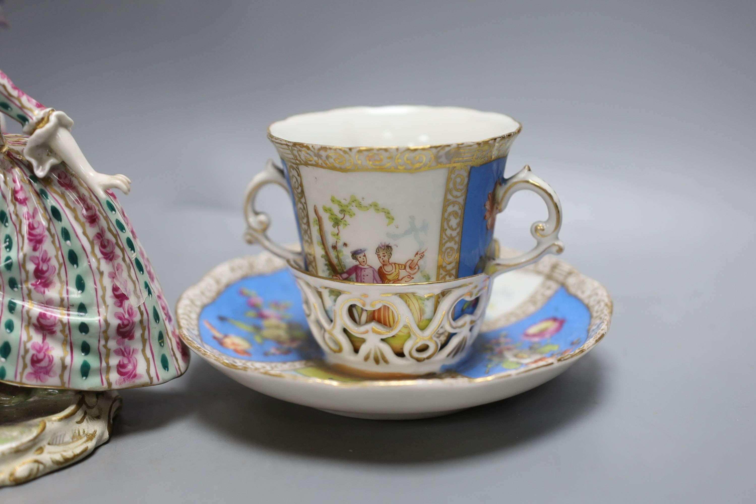 A Dresden floral encrusted pot pourri vase and cover, 29cm tall, a figure of a lady and a Dresden cup and trembleuse saucer